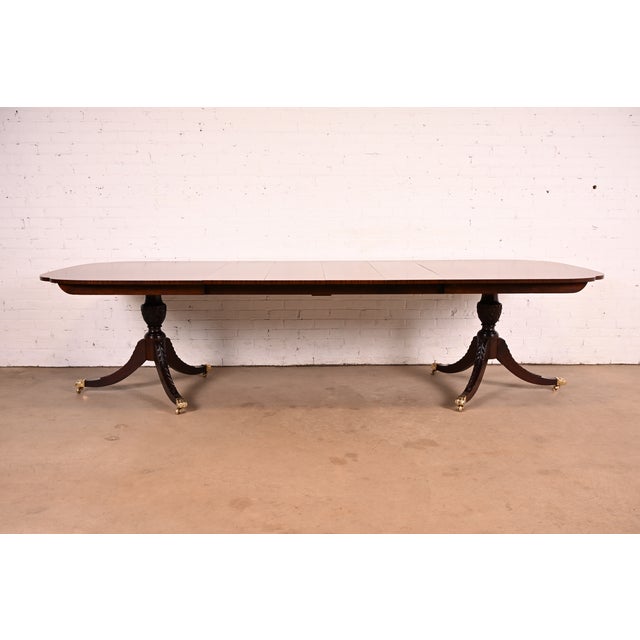 An exceptional Georgian or Regency style double pedestal extension dining table By Stickley USA, 2006 Gorgeous book-...