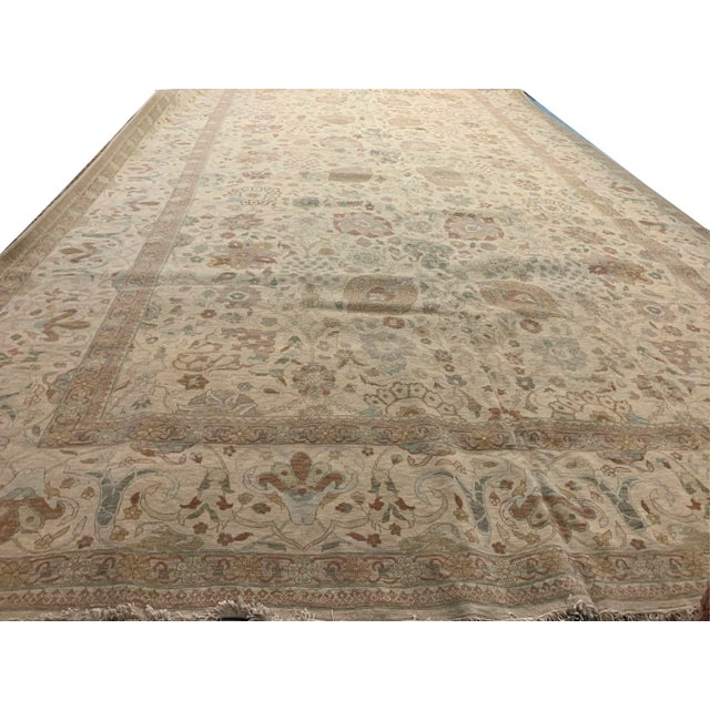 A classic recreation of an antique rug design hand knotted in Egypt using the finest of materials. Colors: cream/dark &...