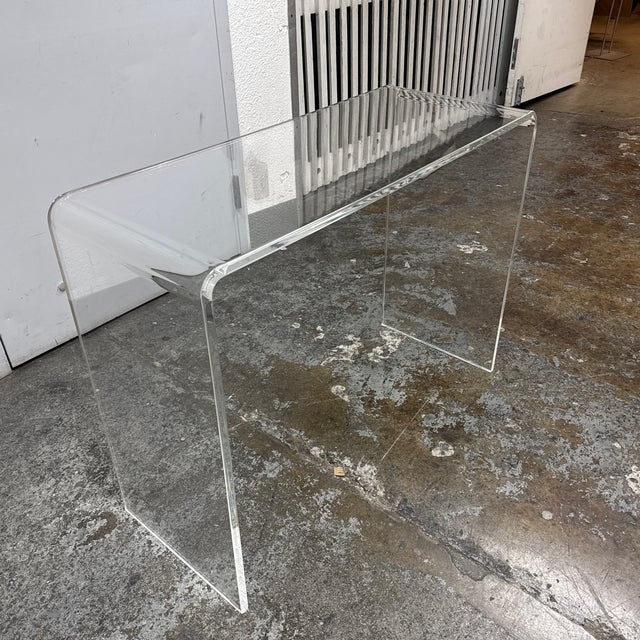 Design Plus Gallery presents the Peekaboo Acrylic Console Table from CB2. Formed from clear acrylic, the table has a...
