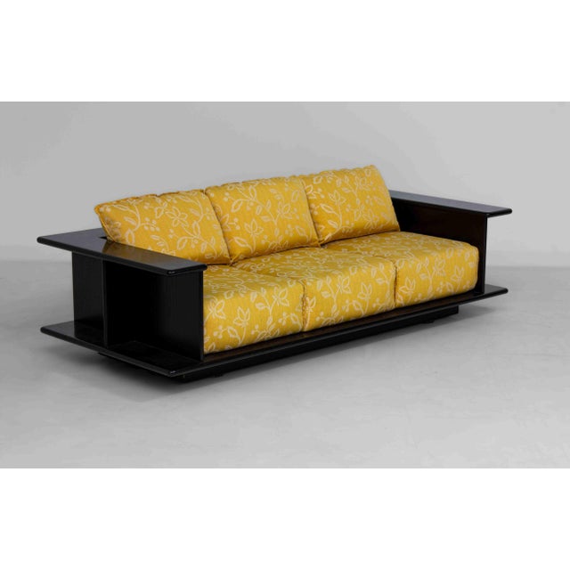 Sculptural Italian three-seater sofa, most likely by Carlo Bartoli from the 1970s, featuring a frame in black lacquered...