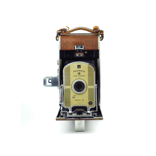 Elevate your bookshelf or office gallery with a quintessential piece of American design history: the Polaroid Land Camera...