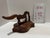 Figural tabletop cutter featuring an iron blade shaped as a horse, with a curved wooden handle extending from the...