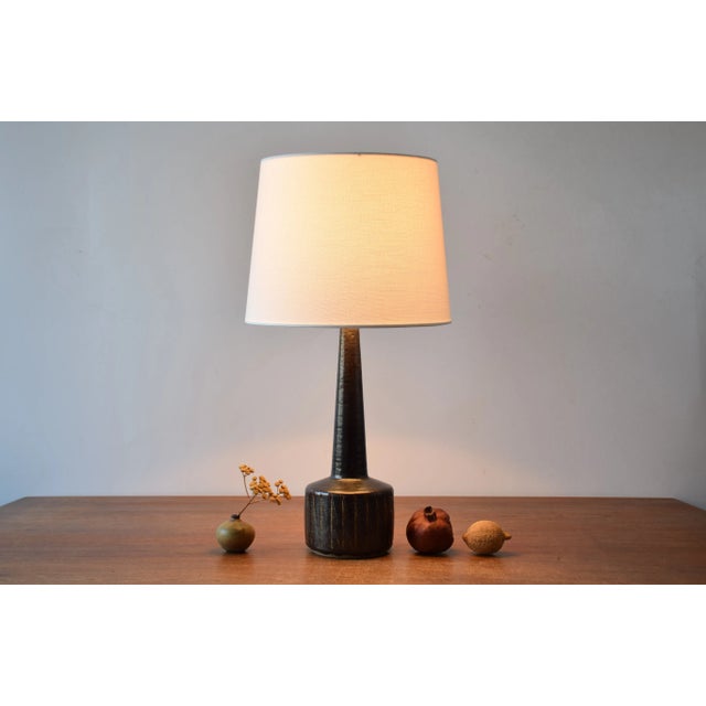 Mid-century Danish ceramic table lamp designed by Per Linnemann-Schmidt for Palshus. Made circa 1960s. The lamp is made...