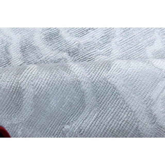Doris Leslie Blau collection handmade Camellia rug in white silk. Size: 10'10" × 14'10" (330 × 452 cm). This luxurious...