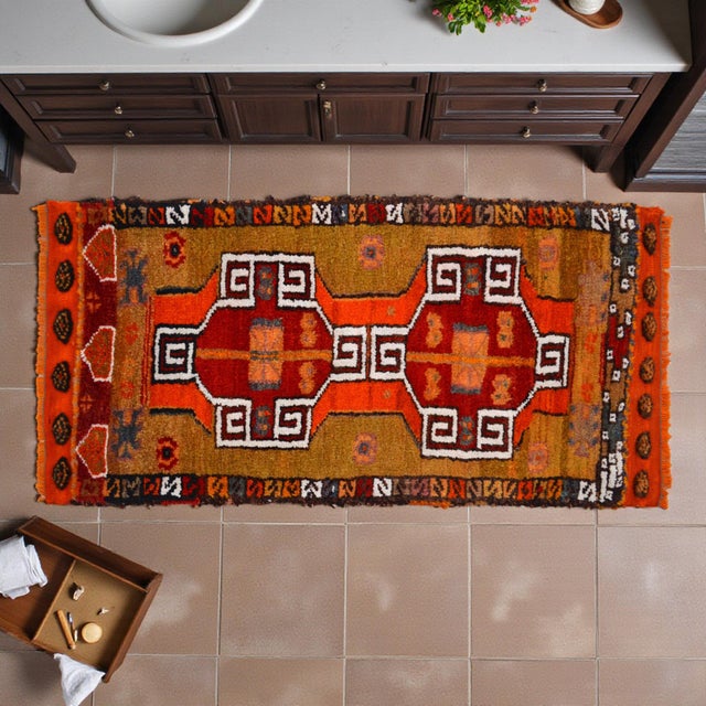 This exquisite hand-knotted accent rug hails from the weaving looms of Chal, Denizli, representing the vibrant artistic...