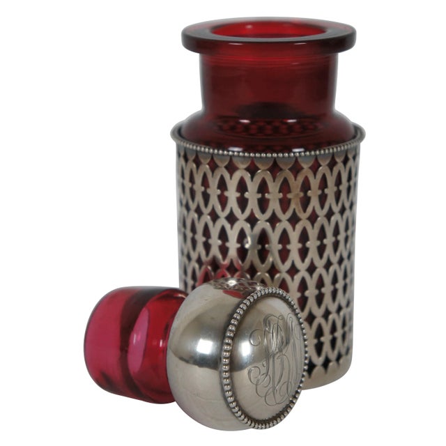 Early 20th century number 114 ruby glass vanity bottle with overlay featuring pierced sides and beaded edge, and a silver...