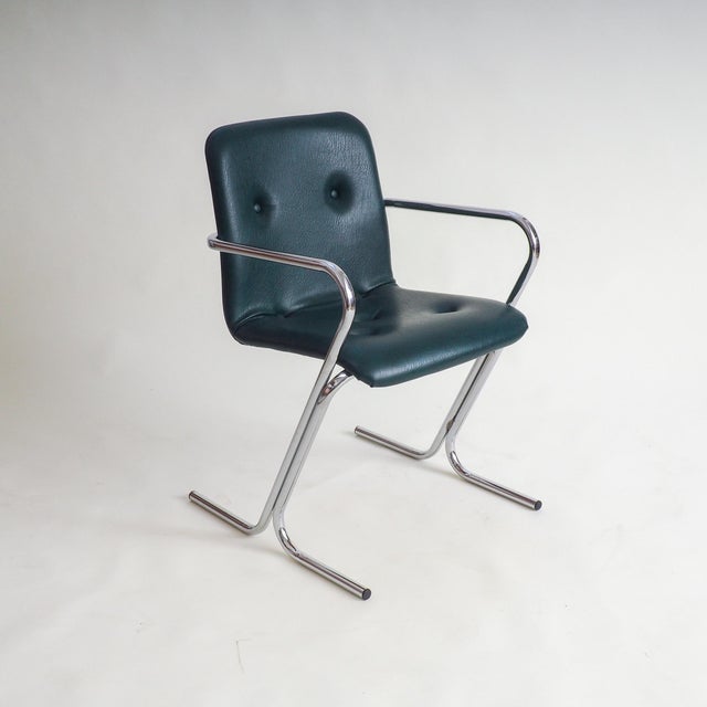 An eye-catching mid-century modern armchair designed by Tavo in Belgium during the 1970s. This piece features a...
