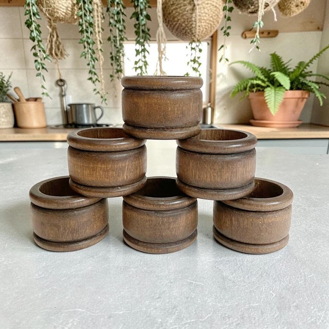 Elevate your dining experience with our Vintage MCM Teak Wood Napkin Rings, a stunning set of 6 that embodies the essence...