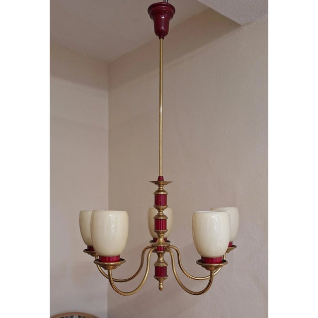 Vintage Chandelier with Brass and Cream-Colored Glass Shades, 1970s, in Good conditions. Designed 1970 to 1979 European...