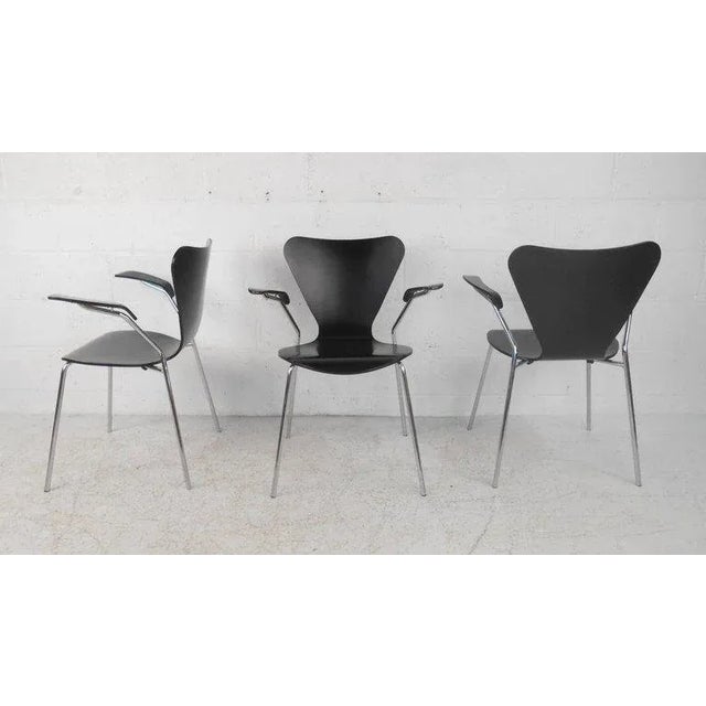 This beautiful vintage modern chair features unique winged back rests, high arm rests, and bent rod chrome frames. Sleek...