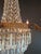 Brass Antique Italian Neoclassical Crystal Chandelier Brass Original Wooden Sockets For Sale - Image 8 of 11