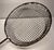 Vintage folk art metal wire scoop with decorative handle.