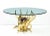 A wonderful sculptural brass 1970s French table with a large amethyst crystal cluster at its center illuminated with an...
