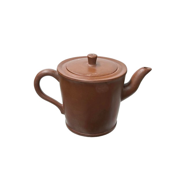 This exquisite vintage Chinese clay teapot embodies centuries of rich tea culture and masterful artistry. Crafted in a...