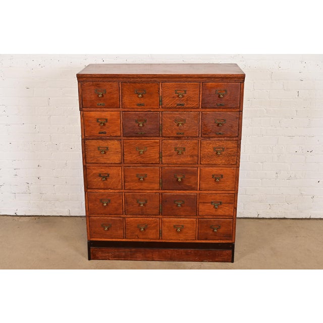 A rare and exceptional antique Mission or Arts & Crafts 24-drawer stacking card catalog or file cabinet In the manner of...
