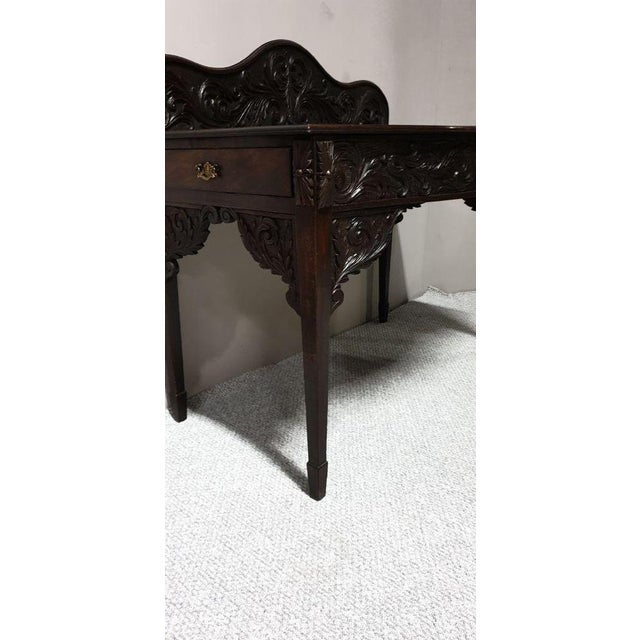 A very nice Georgian mahogany serpentine fronted and carved console/Hall table with side drawer, standing on side feet....