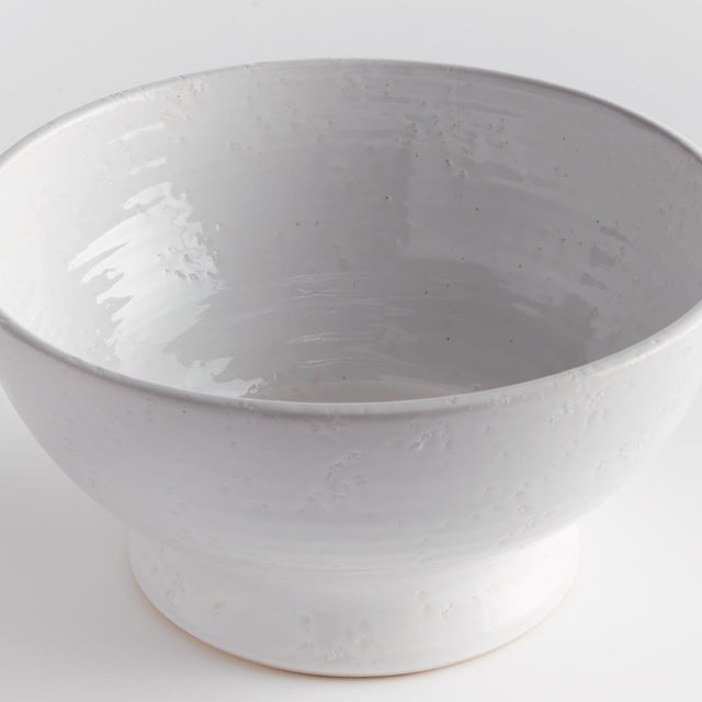 Subtle throw lines and natural textures from the firing process give this terracotta bowl a vintage look. Finished in a...