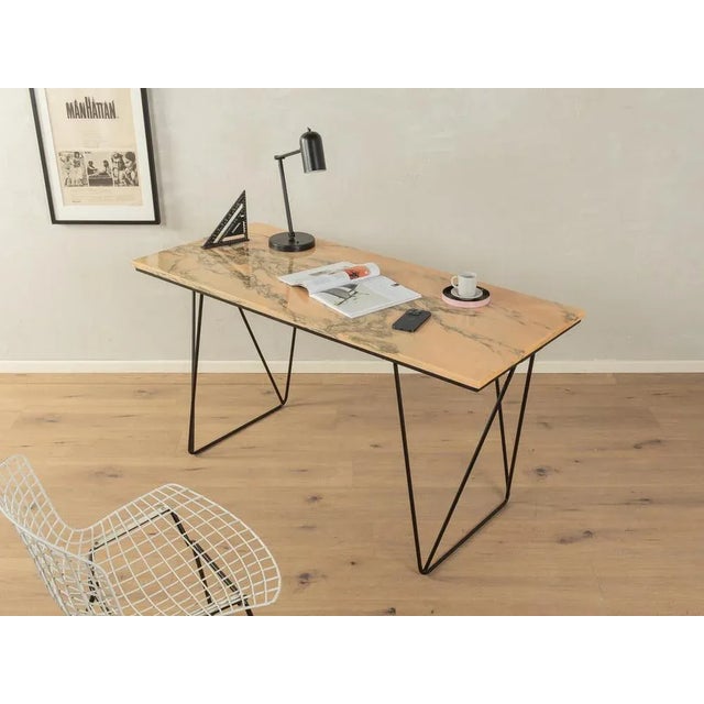 Unique desk from the 1960s with a marble table top in beige, cream, pink and brown tones and new delicate steel feet in...