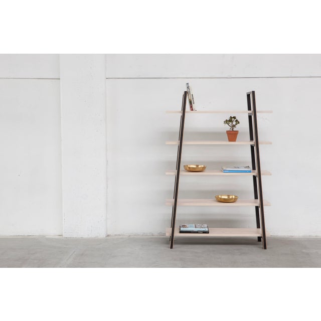 This monochrome solid European ash series comprising a dining table, bench, coffee table, and bookshelf, was designed for...