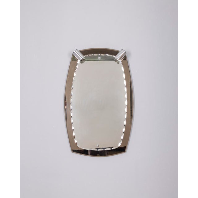 Wall mirror with smoked glass frame, the glass is ground and has two chromed metal spotlights at the top, Italian design,...