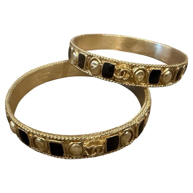 Contemporary Two 1990s Iconic Gold Plated Metal and Black Enamel Bangle Bracelets by Chanel For Sale - Image 3 of 11