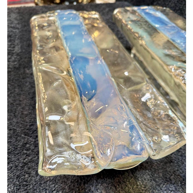 A luminous trio of sculptural sconces by Mazzega, crafted from Murano glass in Italy during the late 1960s to early 1970s....