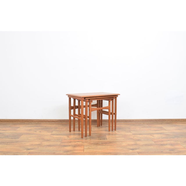 This set of three tables was manufactured in Denmark in the 1960s. The tables have been professionally and carefully...