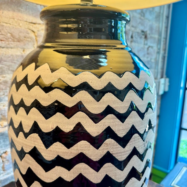 These are Currey &amp; Company oversized ceramic table lamps featuring a hand-painted black and white chevron pattern. A...