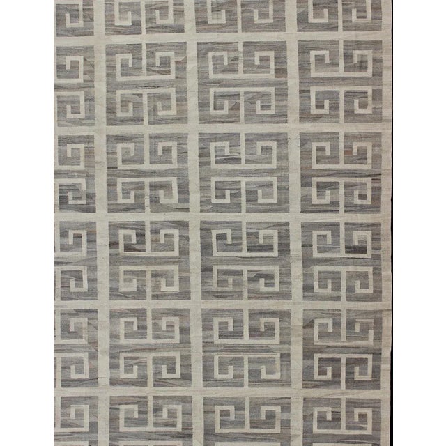 This modern Kilim features a large Greek Key Design, rendered in shades of gray, cream and white. Large Modern oversize...