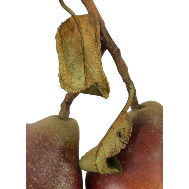 A charming, vintage, English ceramic pear object. Features a ceramic bodied, double red pear with attached stem and tole...