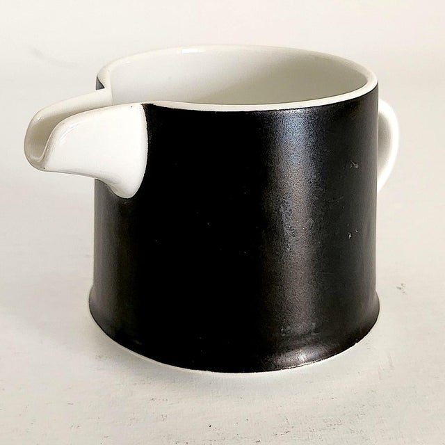 Offered is a vintage creamer with a matte red glaze over white ceramic porcelain by the Otagiri Mercantile Company of...