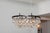 The Ochre Pear Chandelier is a sculptural ceiling fixture known for its elegant, modern form. Dozens of hand-blown glass...