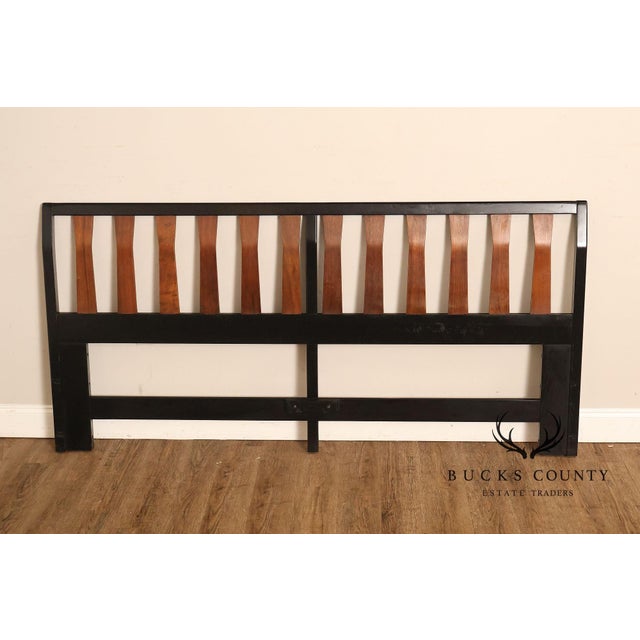 Striking Mid Century Modern king size headboard featuring a bold ebony-finished frame contrasted by sculptural walnut-...
