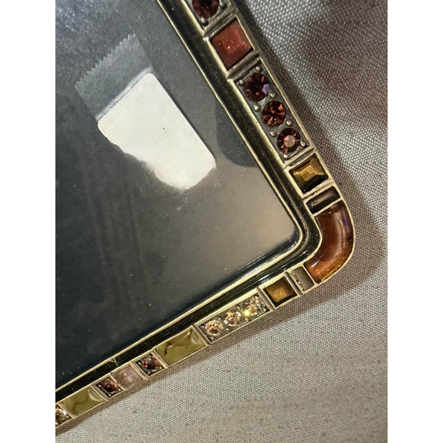 Beautifully made photo frame. Heavy cast bronze or brass frame with inset stone and glass jewels. Goldstone, tiger's eye,...