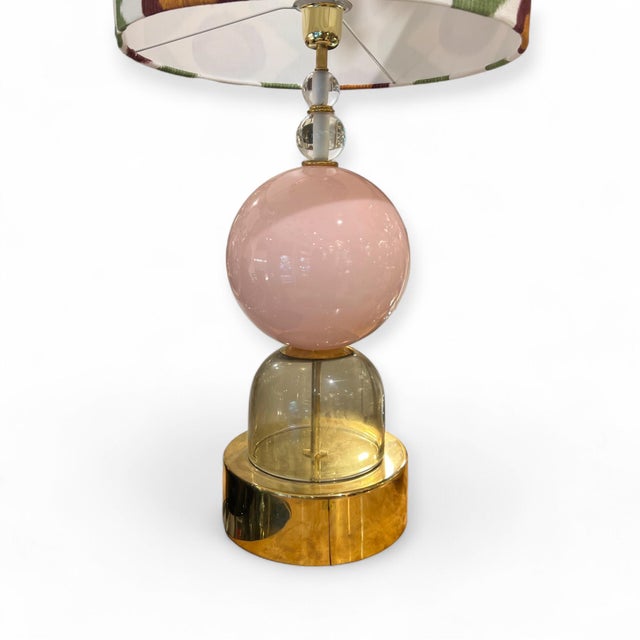 Table lamps made of blown Murano glass, consisting of a large pink globe, two solid clear glass spheres, and a smoked-...