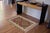 Elevate the elegance of your home with this stunning hand-woven tribal Kilim wool rug. Meticulously crafted on a loom by...