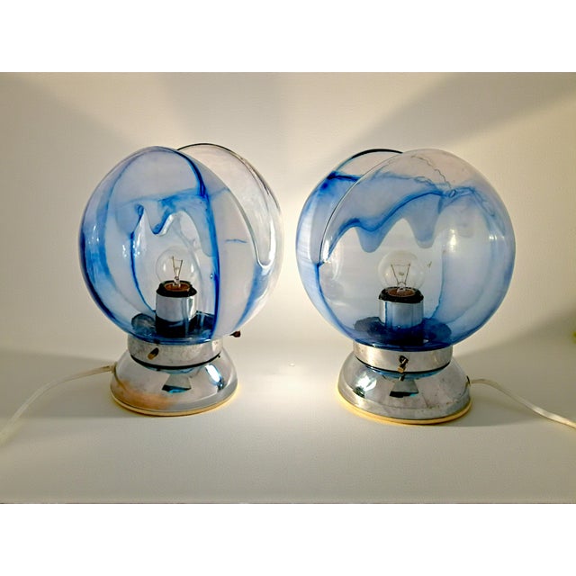 Illuminate your spaces with a touch of iconic design and vibrant color thanks to this pair of Murano glass lamps,...