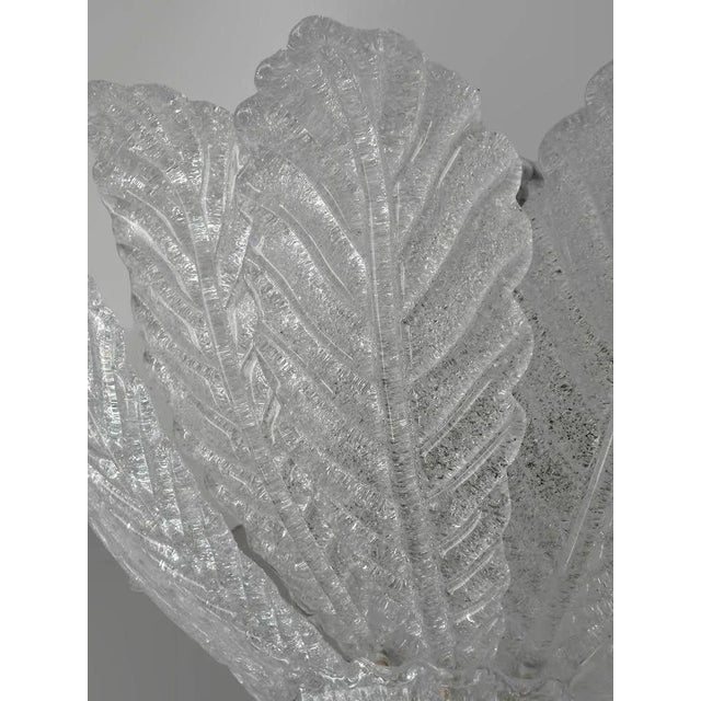 Italian flush mount with clear Murano glass leaves hand blown in Graniglia technique to produce a granular textured...