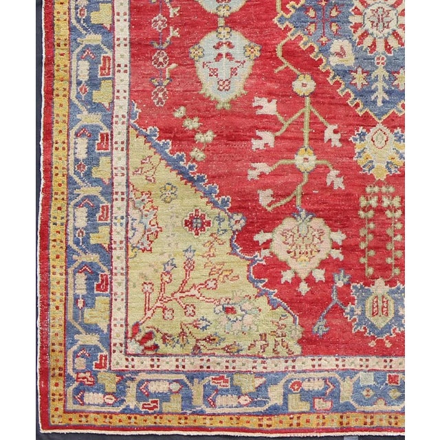 Tribal Early 20th Century Antique Turkish Oushak in Yellow Green, Red & Blue With Floral Medallion Design For Sale - Image 3 of 7