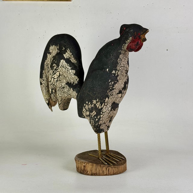 An original hand carved vintage primitive Folk Art rooster. He's a beastly and glorious thing where we can almost hear his...