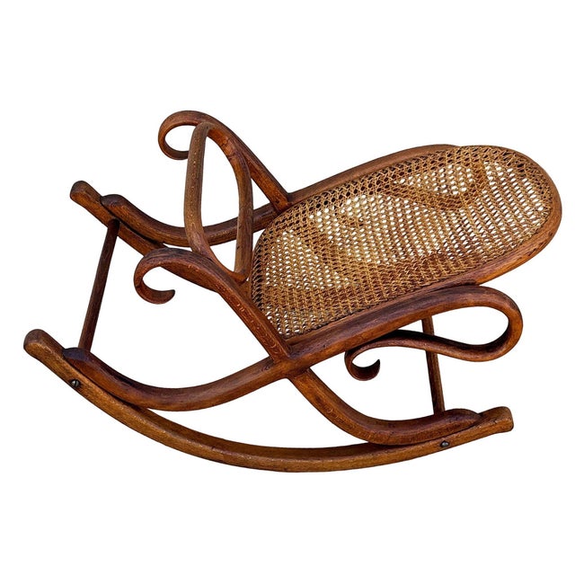 Victorian Thonet No.7001 rocking chair foot stool featuring an elegant, sculptural frame crafted from warm-toned bentwood...