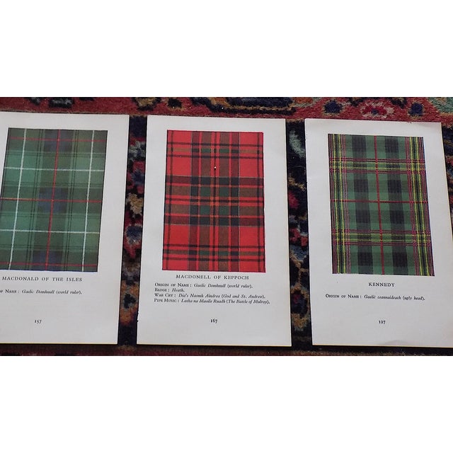 This vintage mid 20th centuey set of fifteen (15) lithographs (offset) depict Scottish tartan plaids. On the verso...