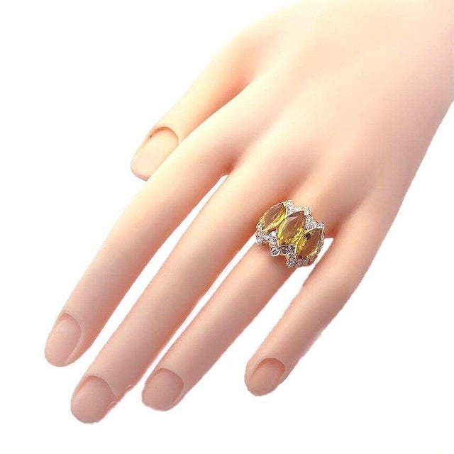 This is a stunning cocktail ring, from 18k yellow gold in a fine polished finish. It is exquisitely crafted in 18k yellow...