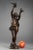 Bronze sculpture with brown patina by charles-alphonse gumery, featuring a smiling young woman with doves. This bronze...