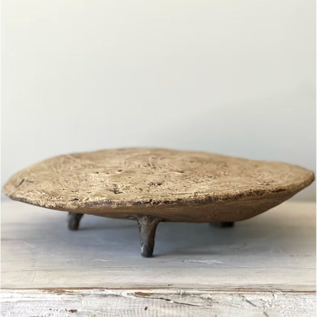 Trent Kendrick VESSEL - MESA stoneware with glaze A flat form raised on three legs, hovering just above the surface it...