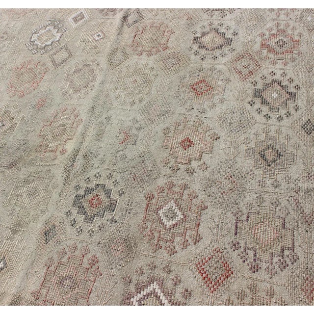 Mid 20th Century Mid 20th Century Vintage Turkish Kilim Featuring Muted Colors and All-Over Tribal Motif Design For Sale - Image 5 of 8