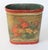 Antique floral leather wrapped wastebasket with wood bottom. No makers mark. Overall age wear.