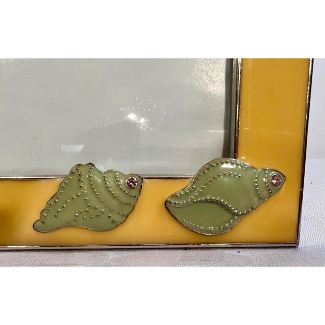 This is a wonderful Vintage Palm Beach Regency Yellow Enameled 4x6 Photo Frame with Two shells incrusted with Crystals by...
