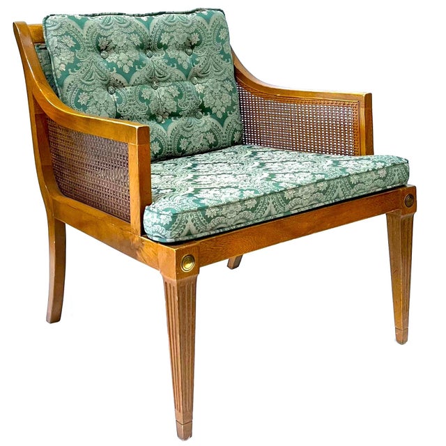 This pair of wood-framed armchairs feature woven cane side panels with green/gold woven damask cushions. Original "pecan"...