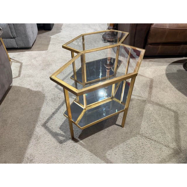 A striking blend of modern glamour and geometric sophistication, this set of two hexagonal side tables by Global Views...